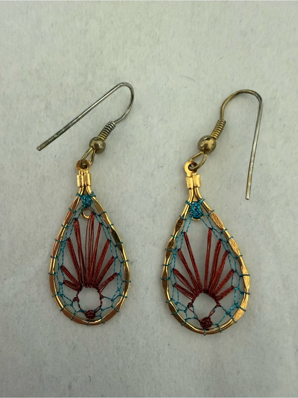 Gold-Trim Teardrop Earrings with Red and Teal Thread Accents